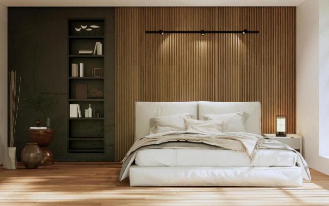 Una habitaci&oacute;n con la cama deshecha.