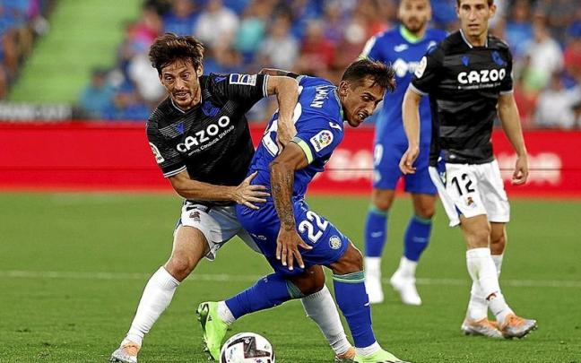 David Silva trata de zafarse de Damián Suárez, en presencia de Aihen Muñoz y Portu. David Silva trata de zafarse de Damián Suárez, en presencia de Aihen Muñoz y Portu.