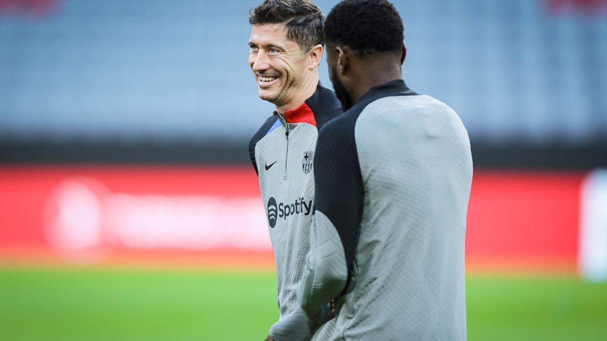 Lewandowski y Kessie, en el Allianz Arena este lunes.