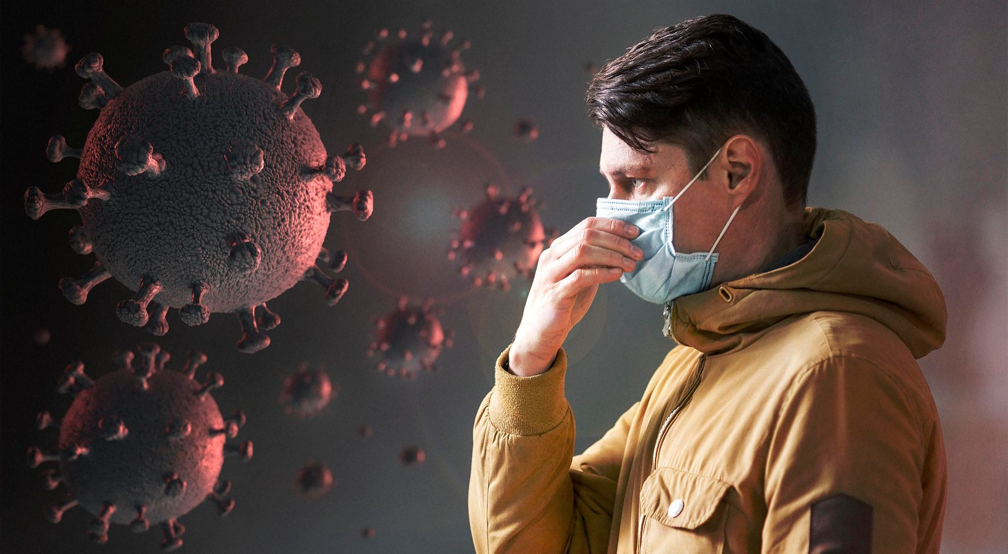 Un hombre con mascarilla junto a una representación de un virus.