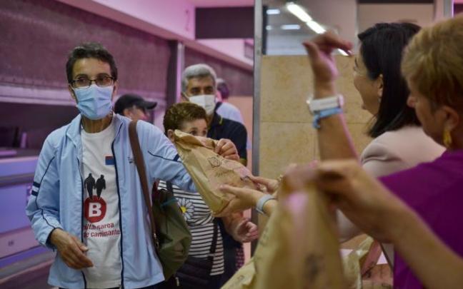 Red de Caminantes en el Mercado municipal del Ensanche