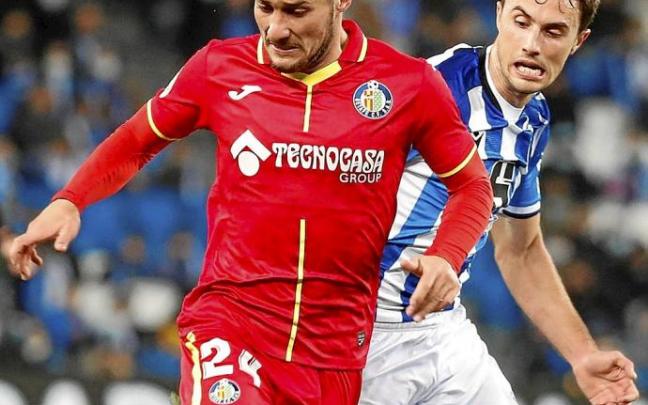 Óscar Rodríguez y Ander Guevara, durante el último choque entre la Real Sociedad y el Getafe. Foto: Efe