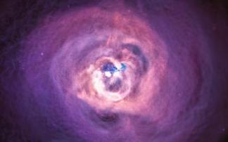 Fotografía astronómica del cumulo de galaxias Perseo con su agujero negro en el centro. Fotografía astronómica del cumulo de galaxias Perseo con su agujero negro en el centro.