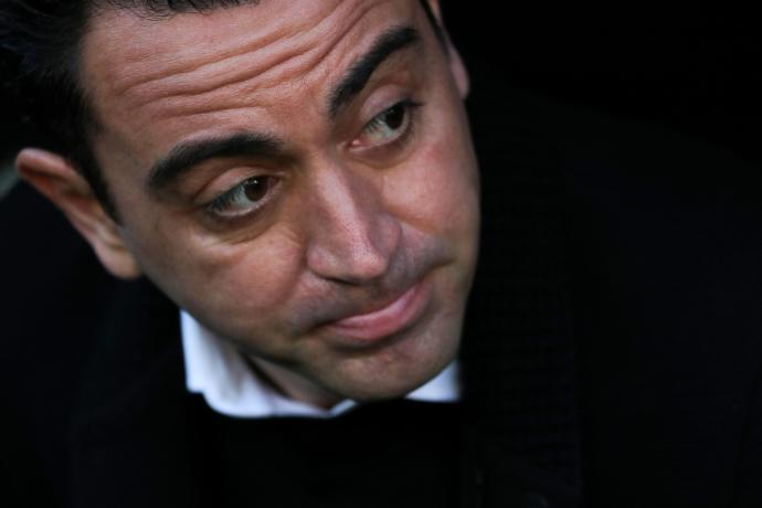 Xavi Hernández, en el banquillo antes de comenzar el partido del pasado domingo en Mestalla (1-4) .